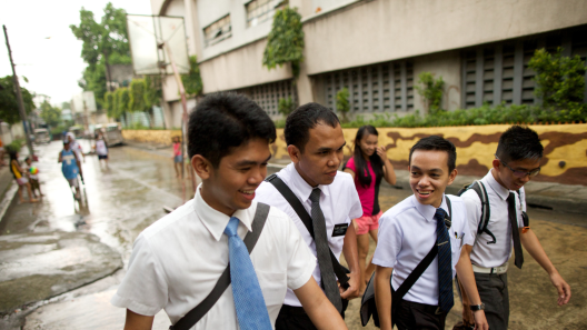 Four Latter-day Saint elders walk outside in the Philippines