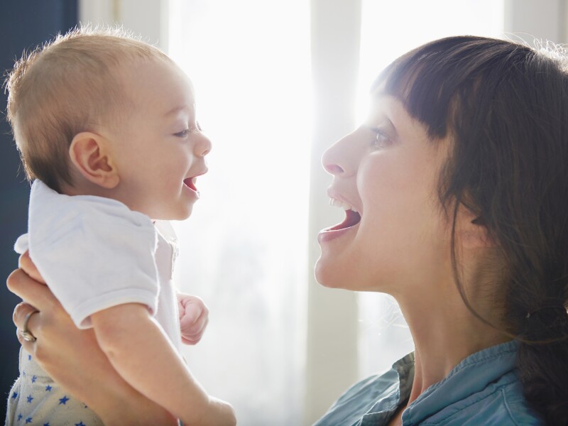mother and baby laughing