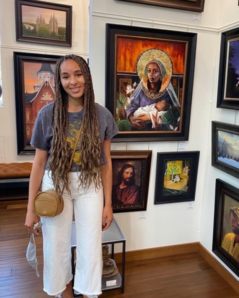 Melissa at the Deseret Book flagship store with her art.