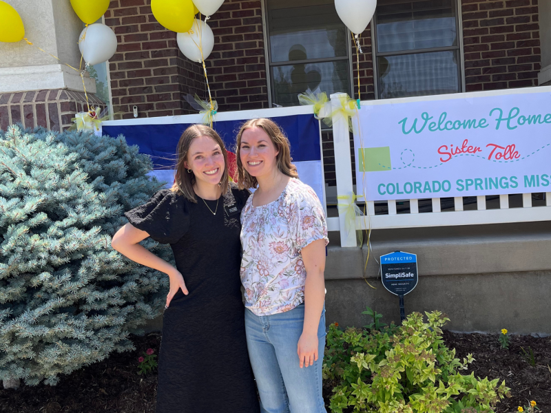 A returned LDS missionary with her sister on her homecoming day