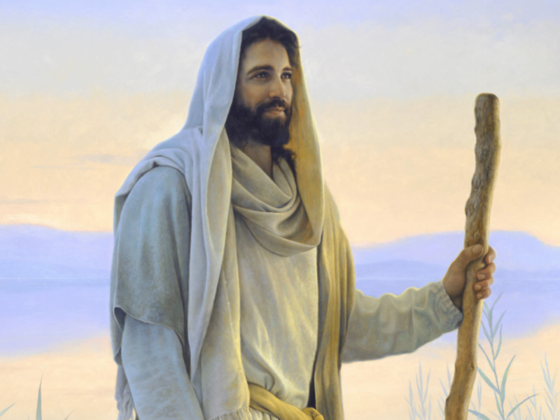 Painting of Jesus Christ holding a staff standing in front of mountains and a lake