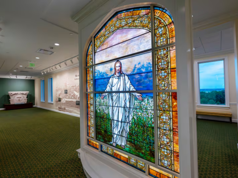 A large art-glass panel of Jesus Christ sits at the end of a long hallway inside the new Nauvoo Temple Visitors’ Center in Nauvoo, Illinois, on Thursday, June 25, 2026.