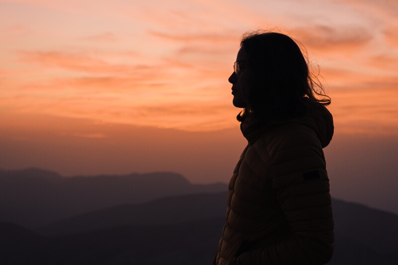 Side view of a woman silhouette during sunset in Jordan.
