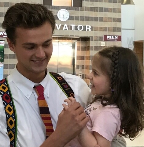 August holding Eden after returning from his mission