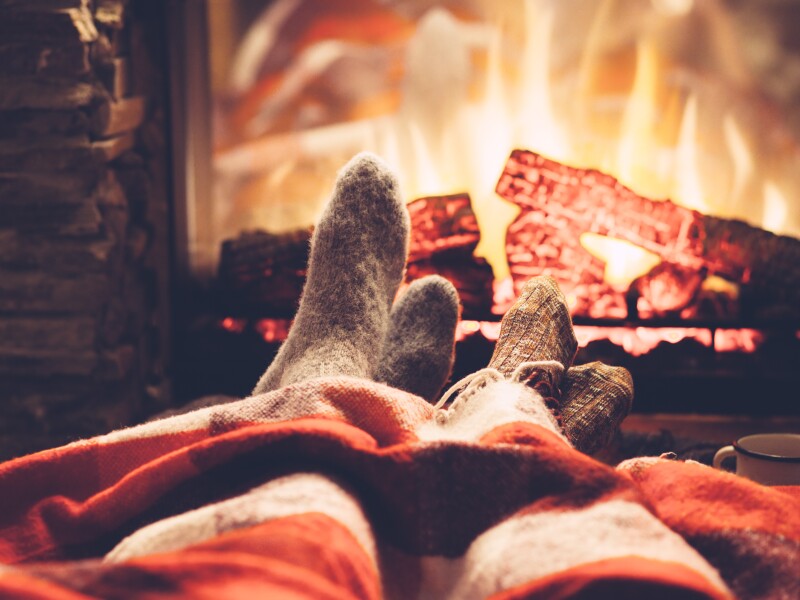 Cold,Fall,Or,Winter,Evening.,People,Resting,By,The,Fire