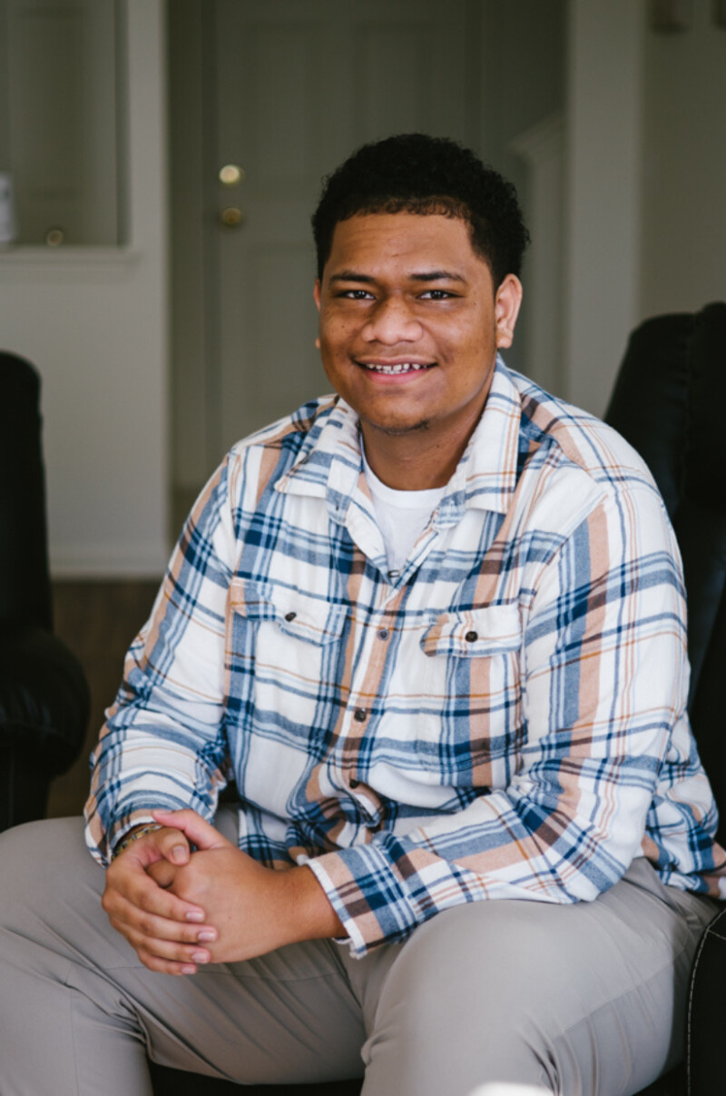 A portrait of a man smiling.
