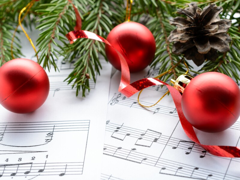 Christmas,Decorations,And,Fir,Branch,Lying,On,Notes,Sheet