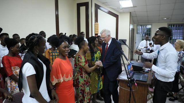 Elder D. Todd Christofferson of the Quorum of the Twelve Apostles greets members of the youth choir at the conclusion of a youth meeting in Abidjan.