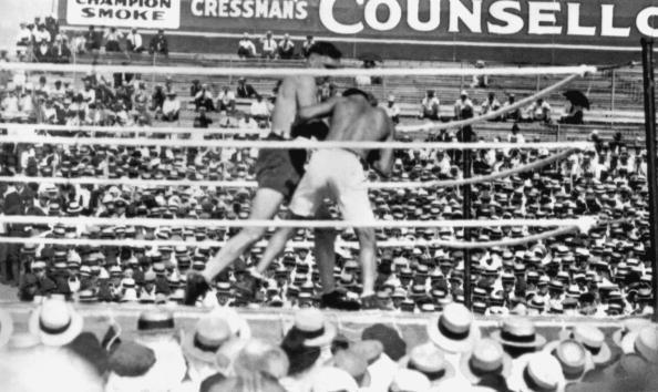 Jess Willard (left) in action against Jack Dempsey during their world heavyweight title fight at Toledo, Ohio, on July 4, 1919. Dempsey won the fight at the end of the third round and he held onto the title until 1926. (Photo by Topical Press Agency/Getty Images)