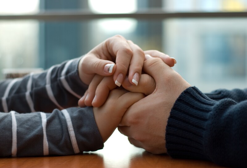 Man,And,Woman,Holding,Each,Other,Hands