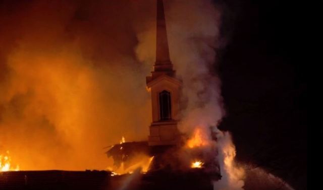 The St. George East stake center in flames.